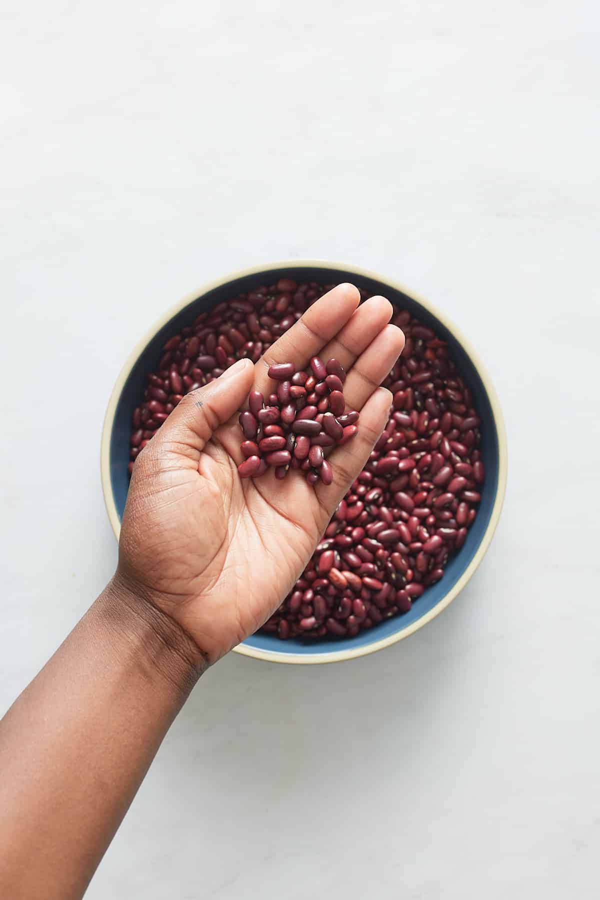 hand holding red kidney beans