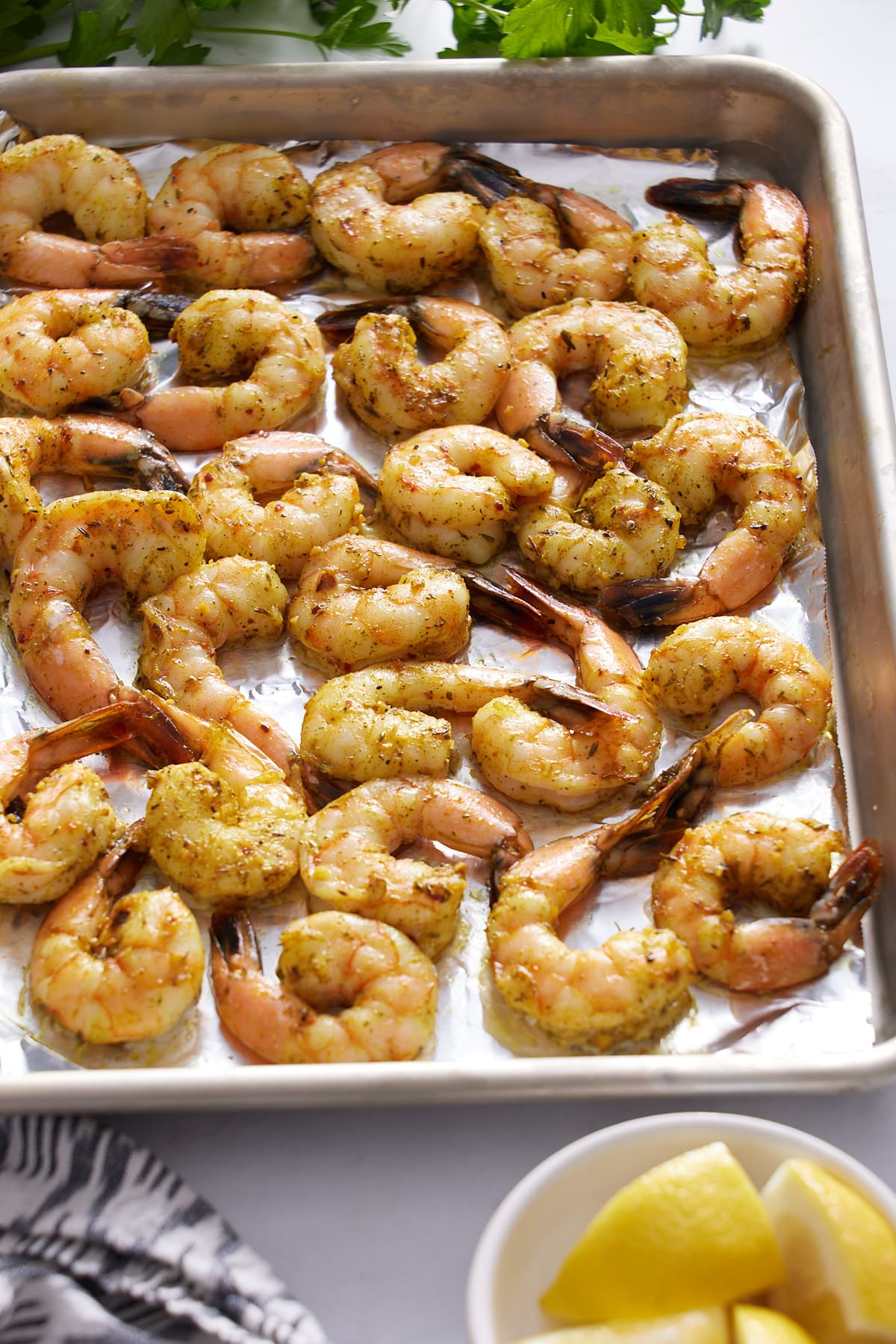 cooked oven baked shrimp with lemon slices