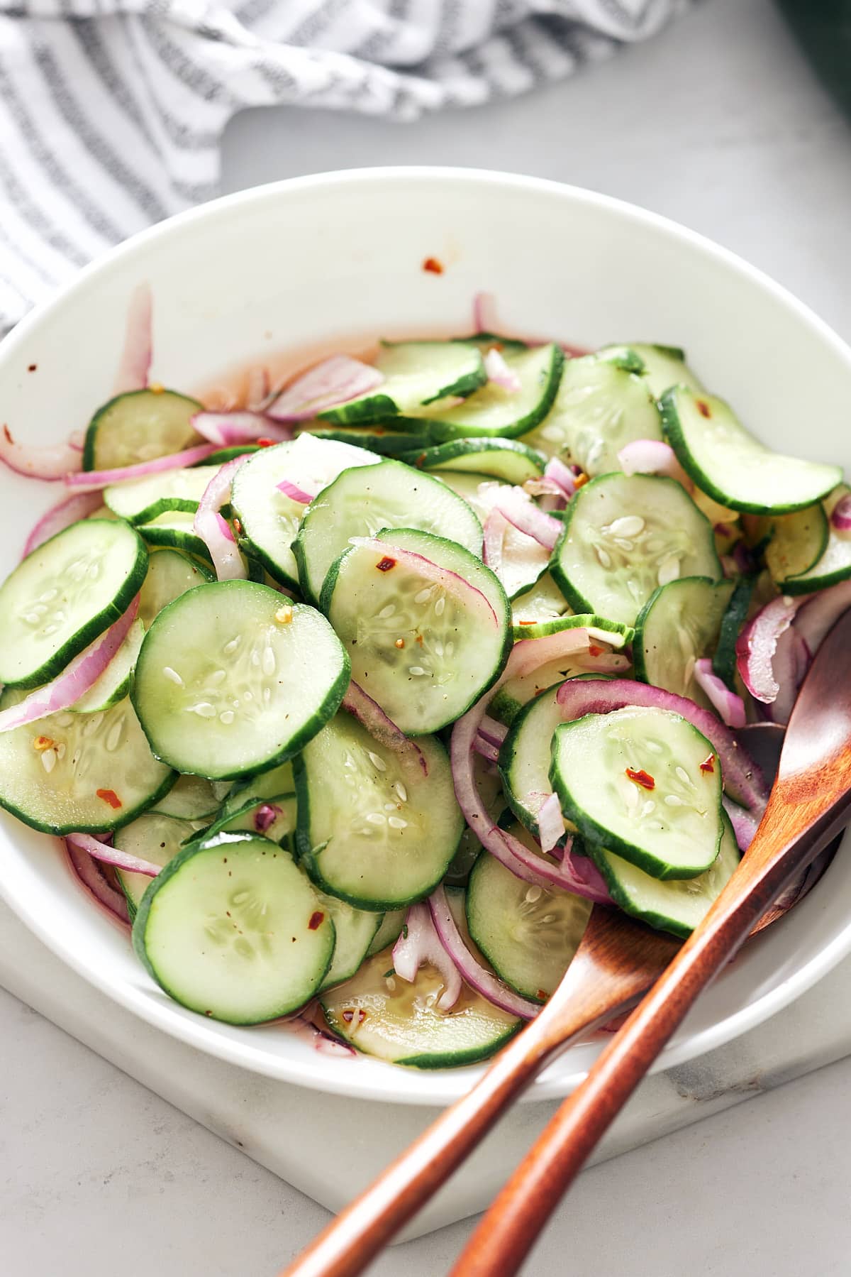 Southern cucumber salad served in a white bowl.