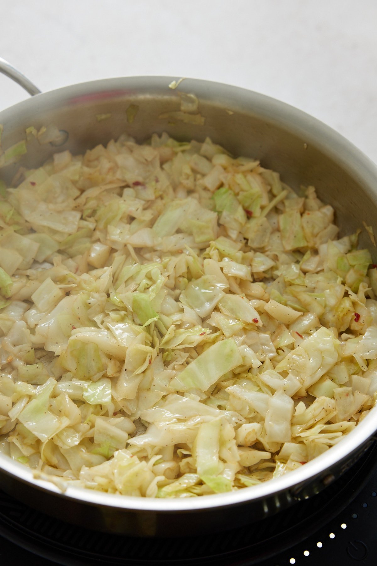 sautéing cabbage in a pan