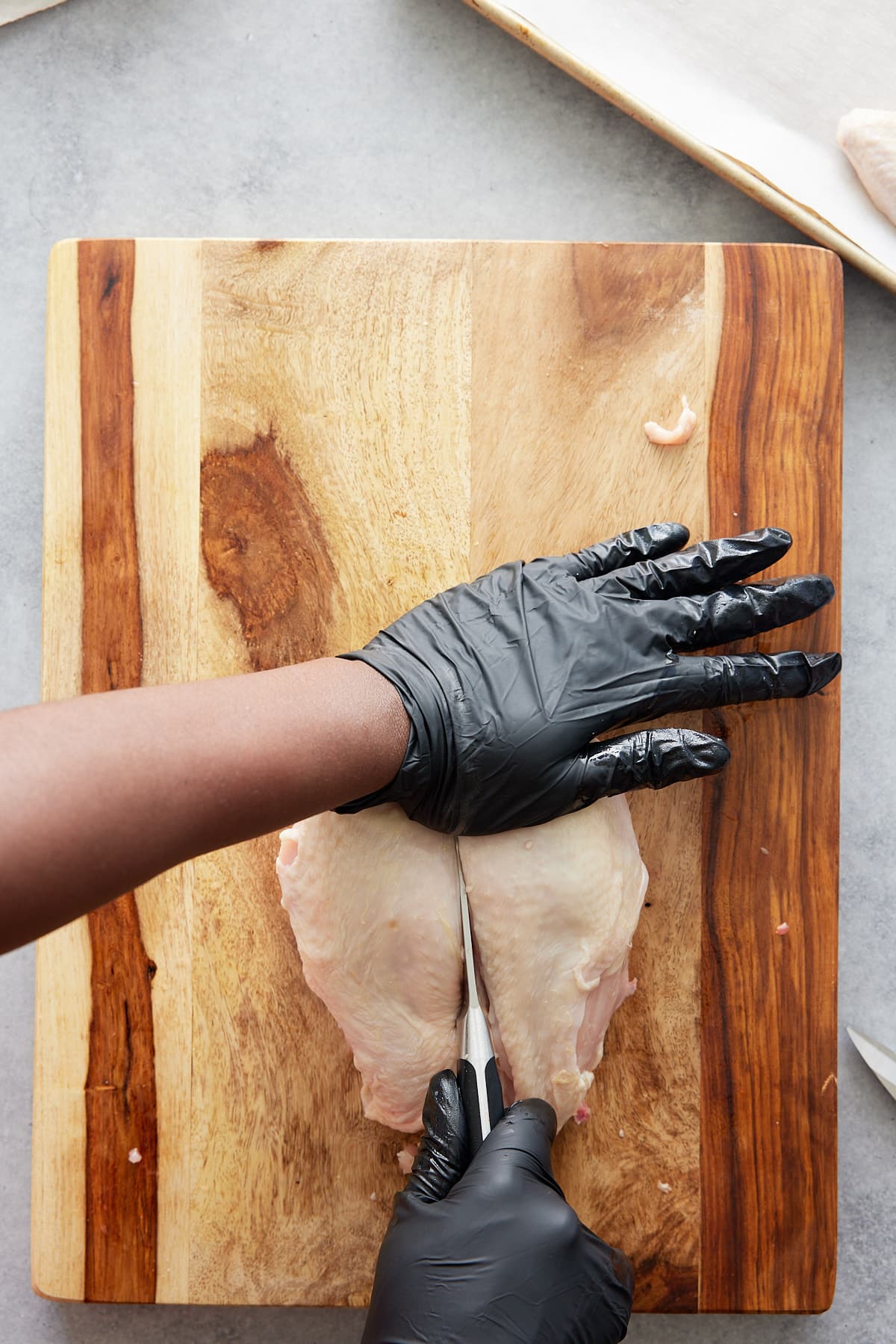 cutting through chicken breast bone