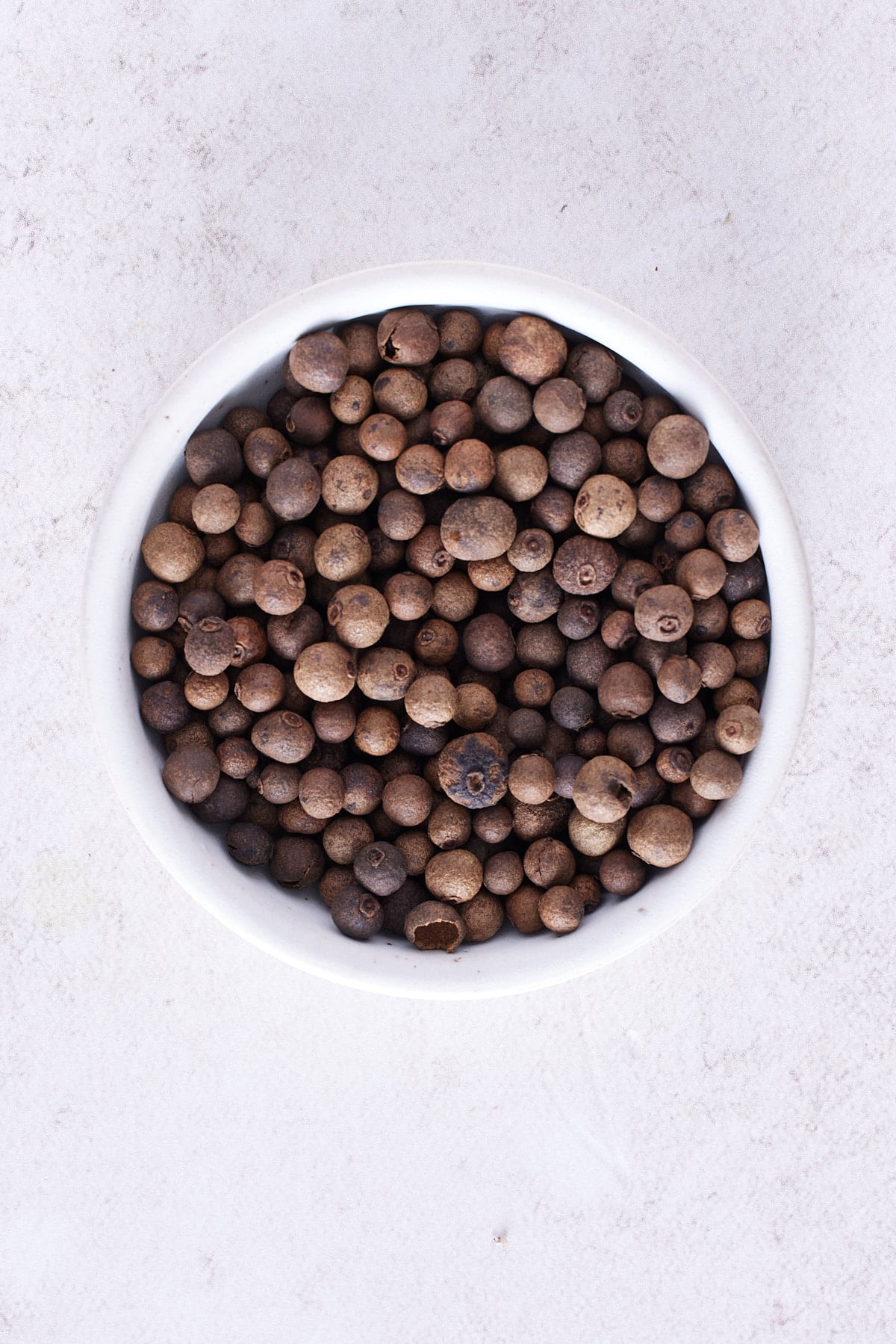 pimento berries on white plate