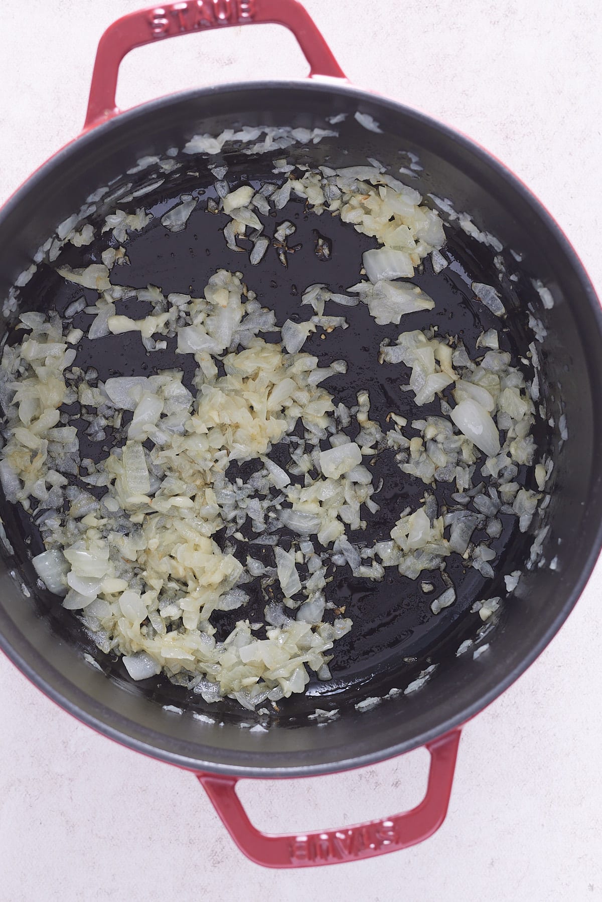 translucent onions in a saute pan