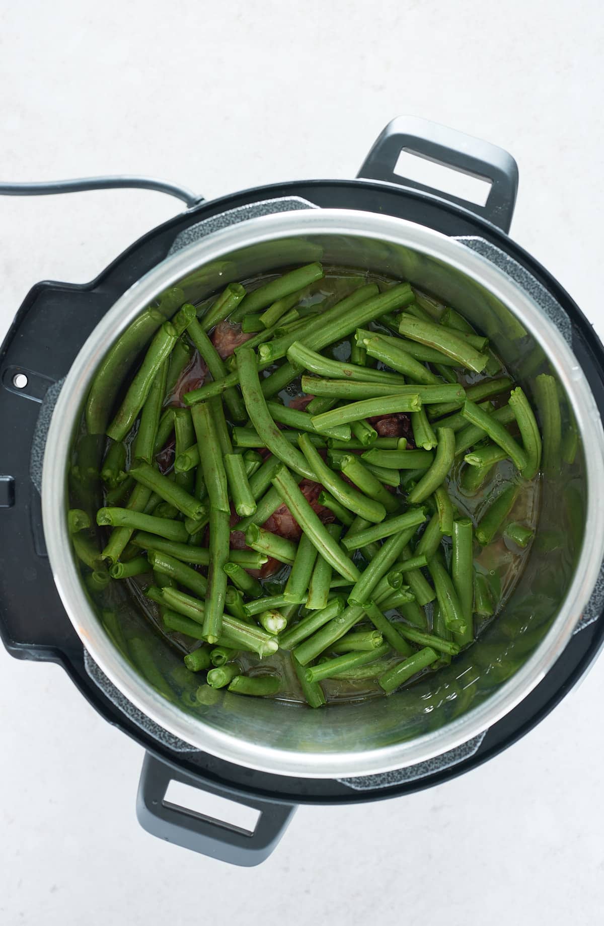 green beans and smoked turkey in an instant pot