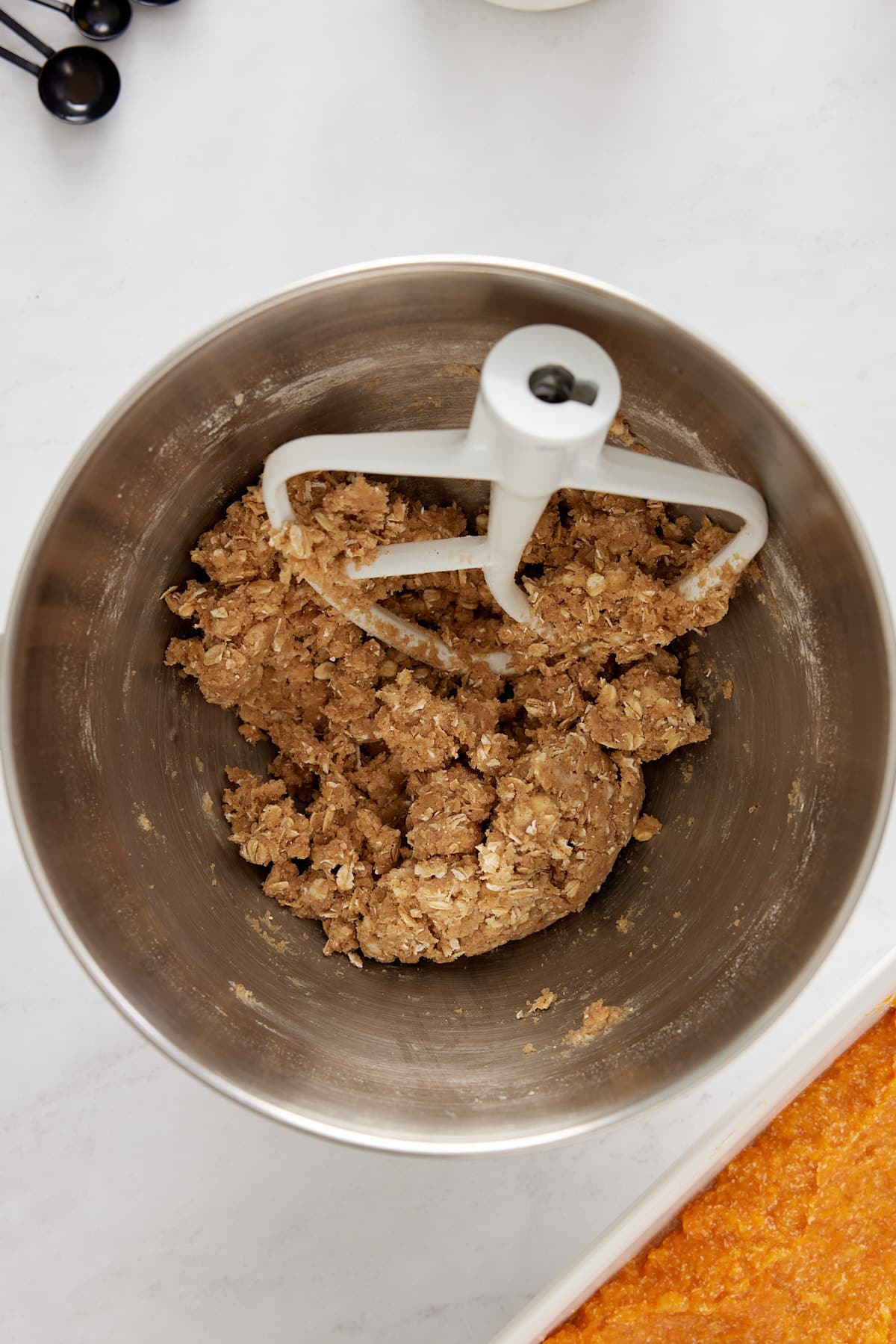 brown sugar topping in a mixing bowl with a white paddle