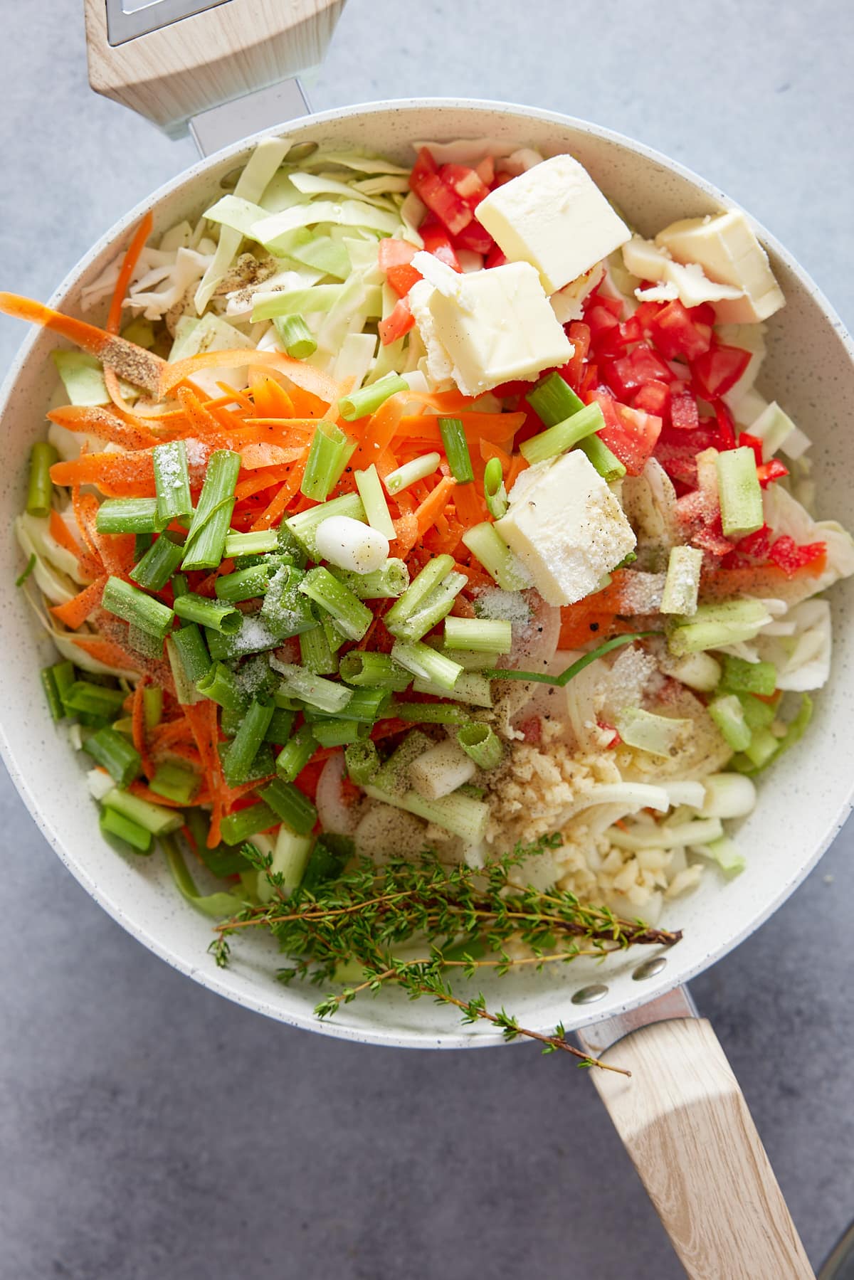 Jamaican cabbage ingredients in a skillet