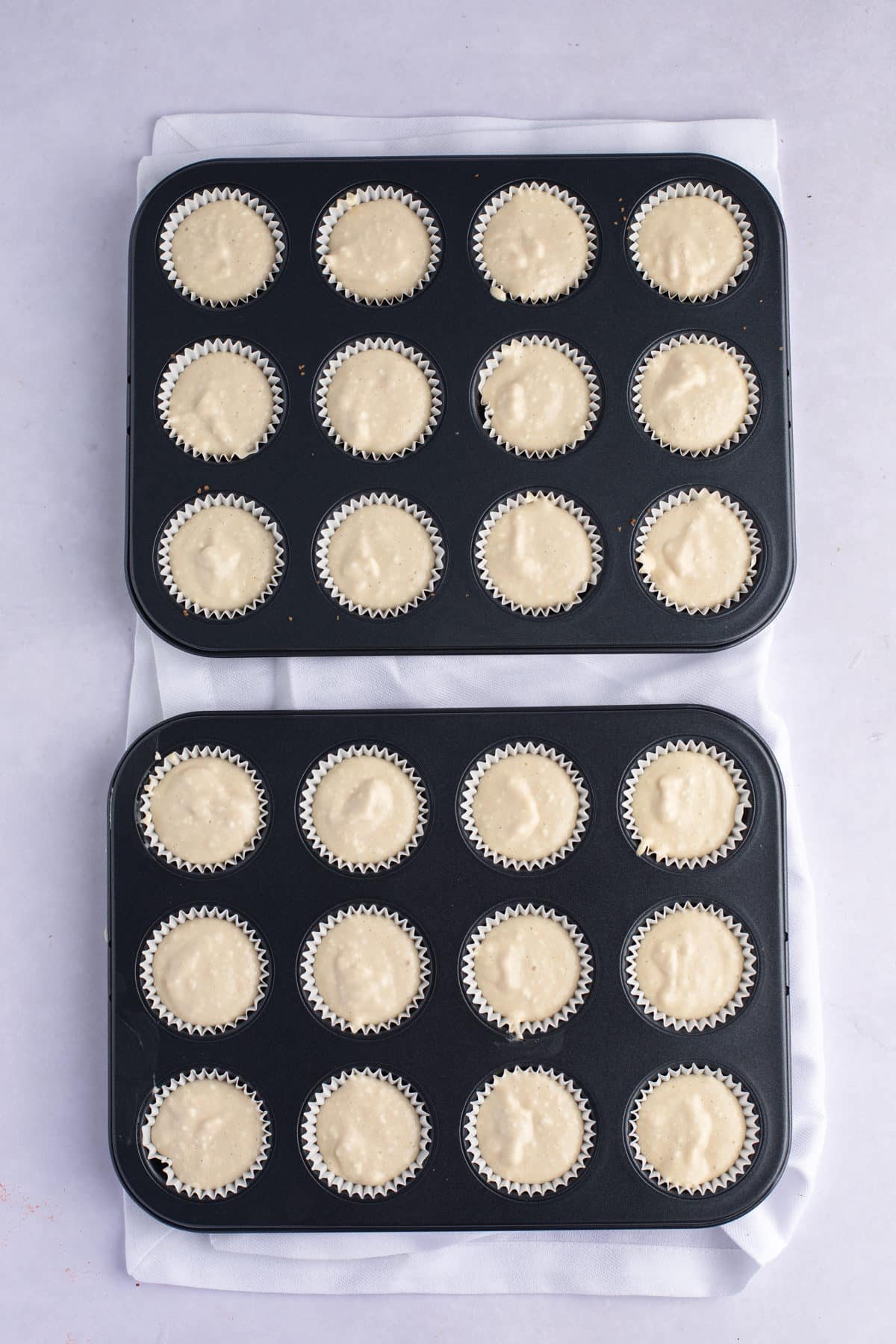 cheesecake filling in 2 mini muffin tins