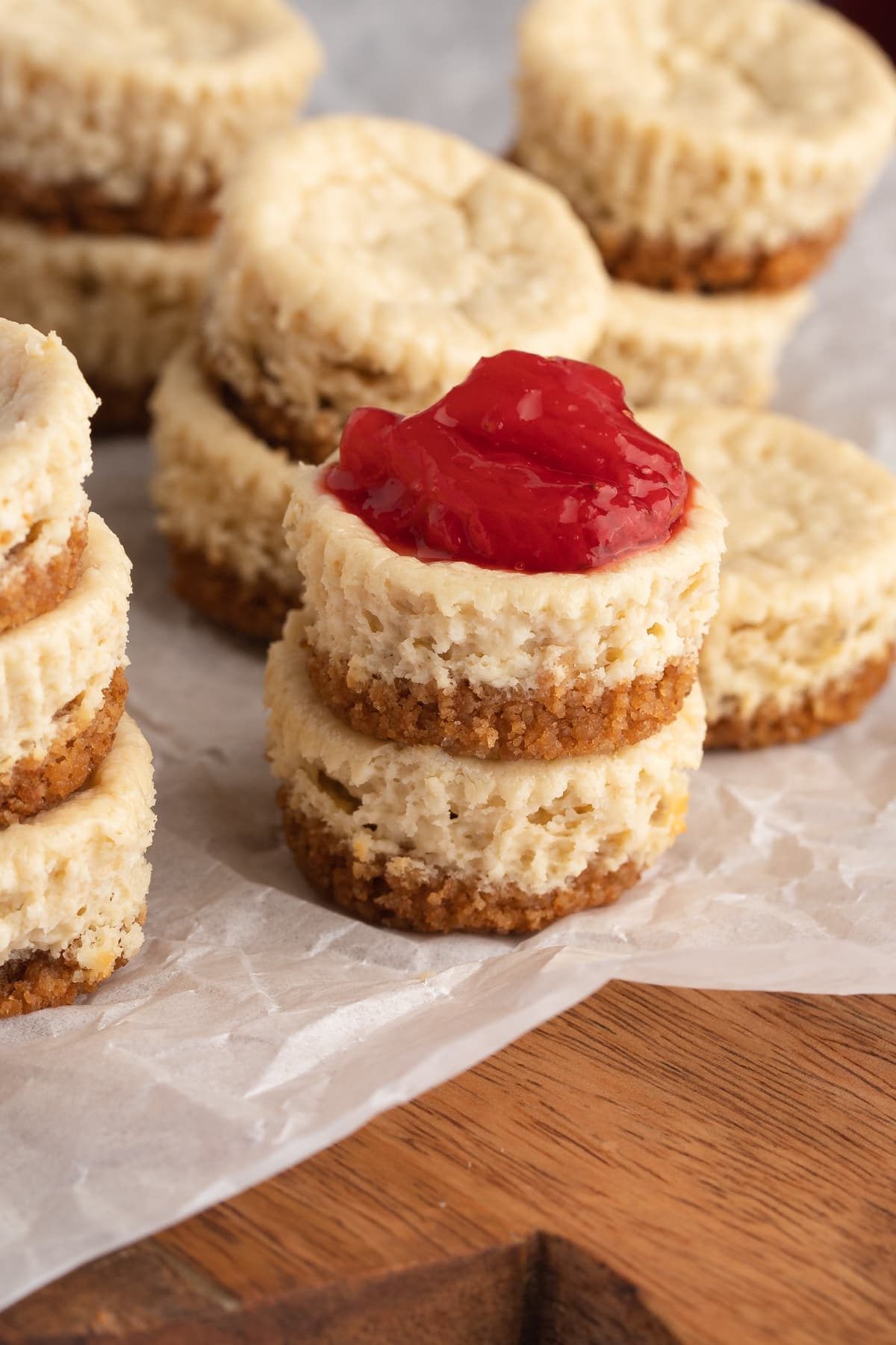 stacks of cheesecakes bites, one with a topping