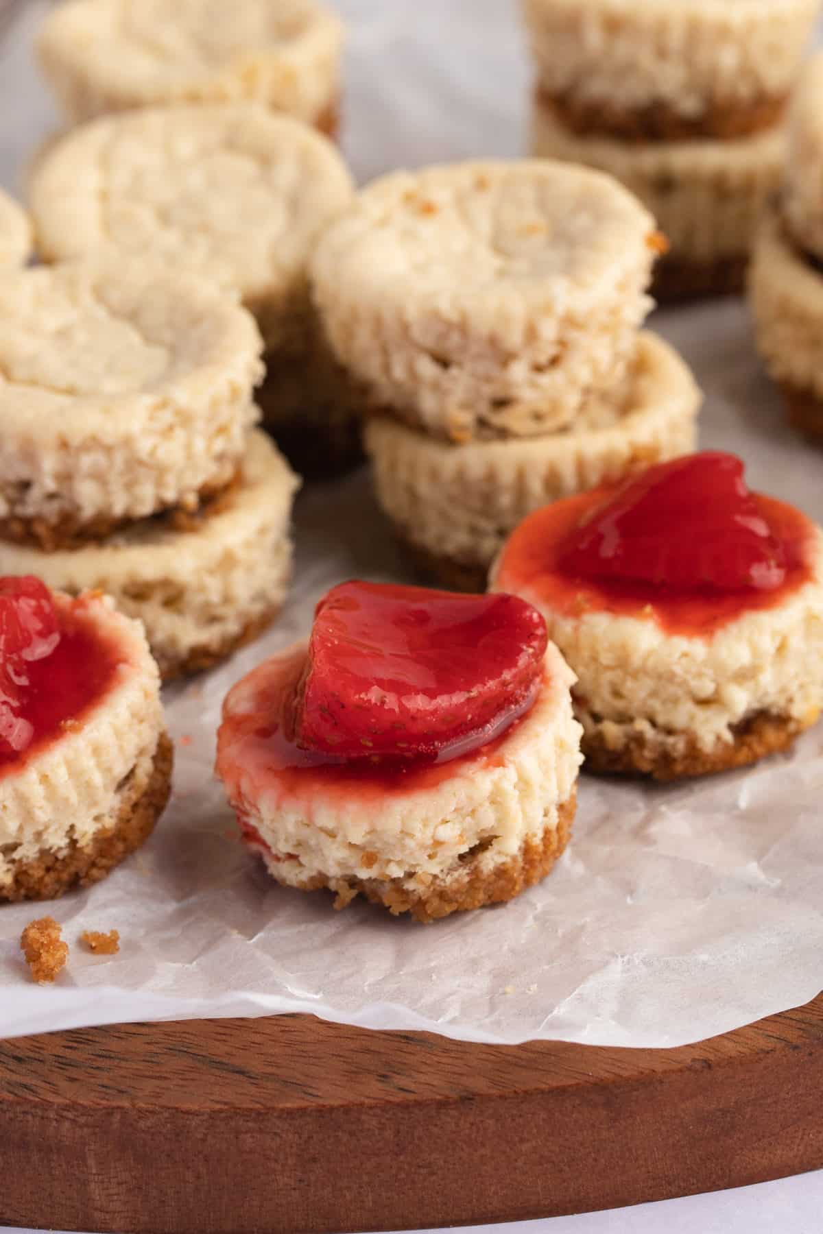 stacks of mini cheesecake bites with strawberry topping