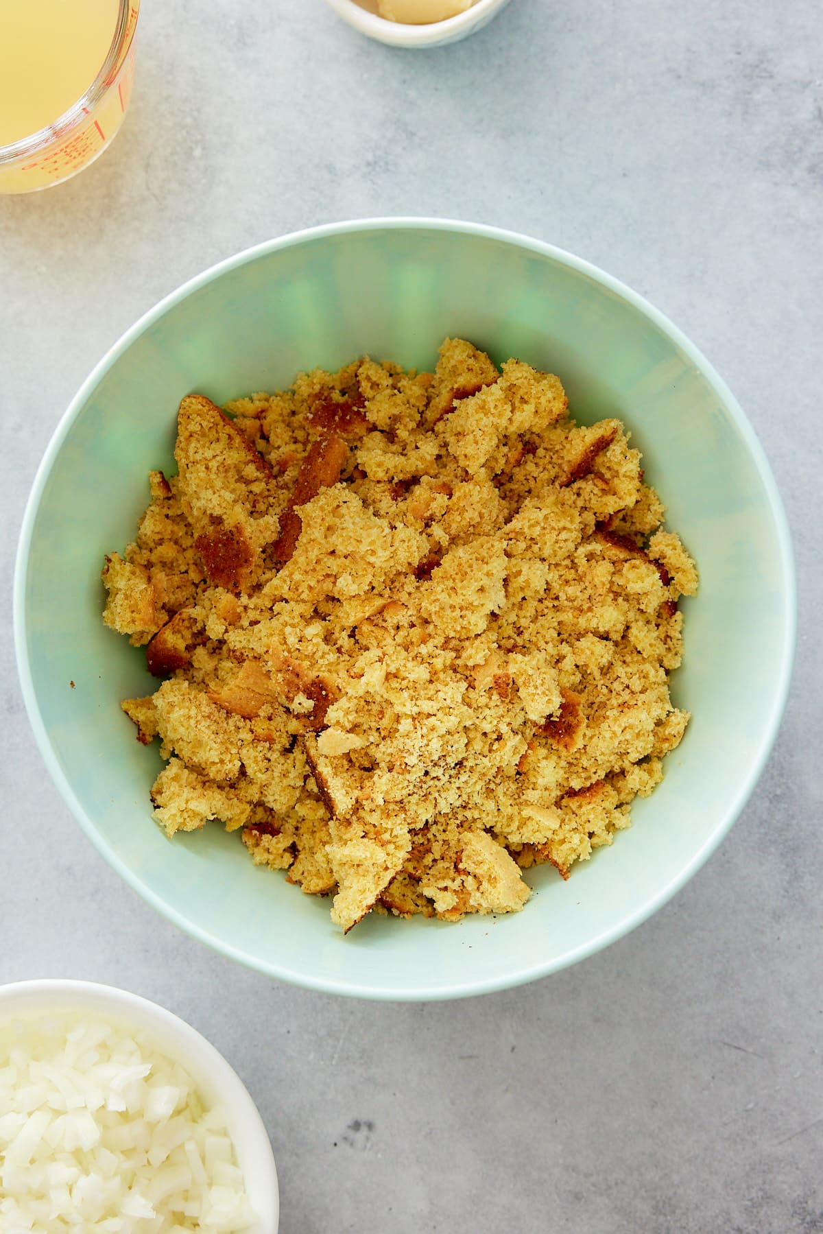 crumbled cornbread in a mixing bowl