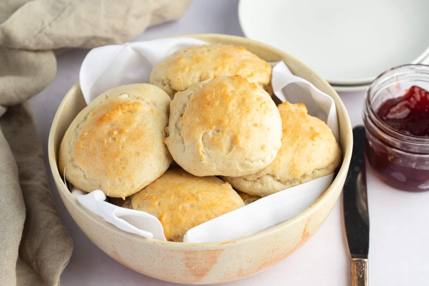 biscuits in bowl with jam on side