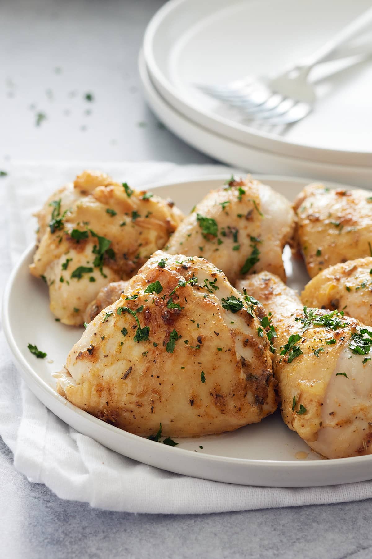 juicy chicken on a white serving plate