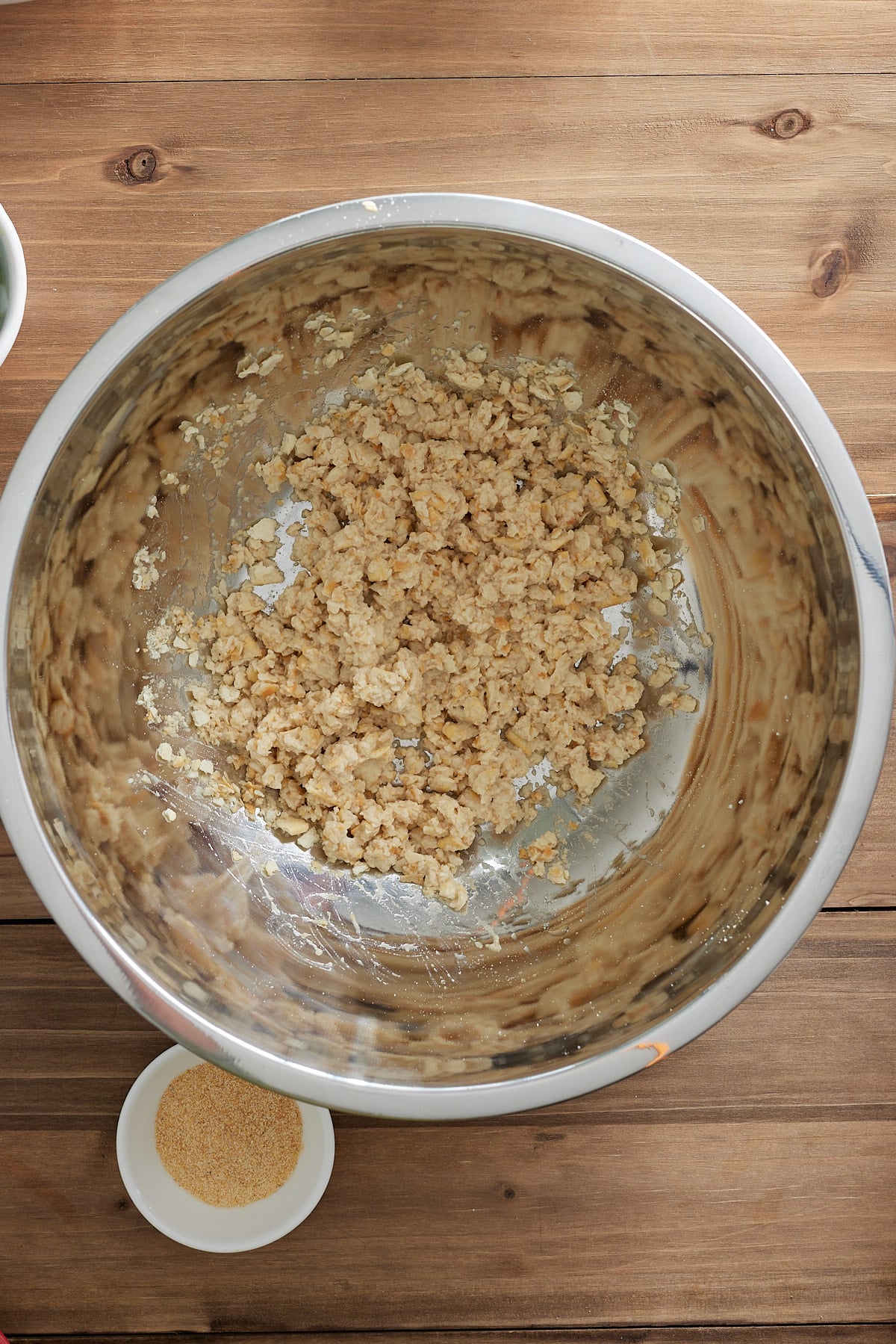 Large silver bowl with crushed saltine crackers