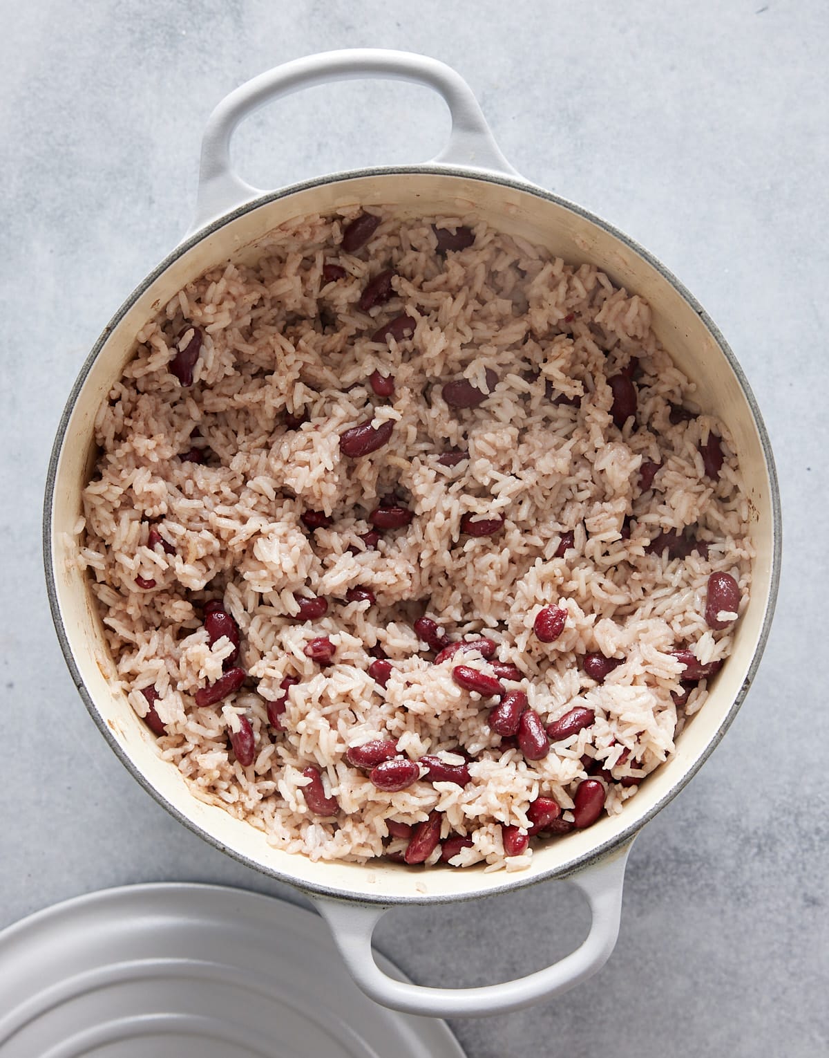 Dutch oven containing cooked Jamaican rice and peas