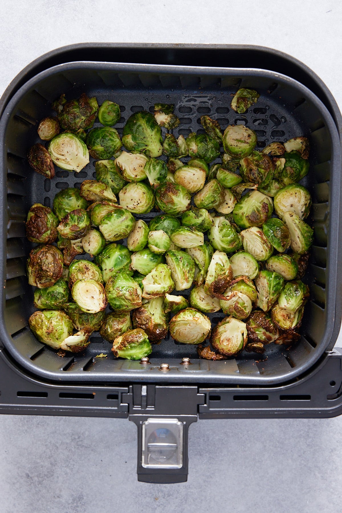 cooked brussels sprouts in the air fryer basket