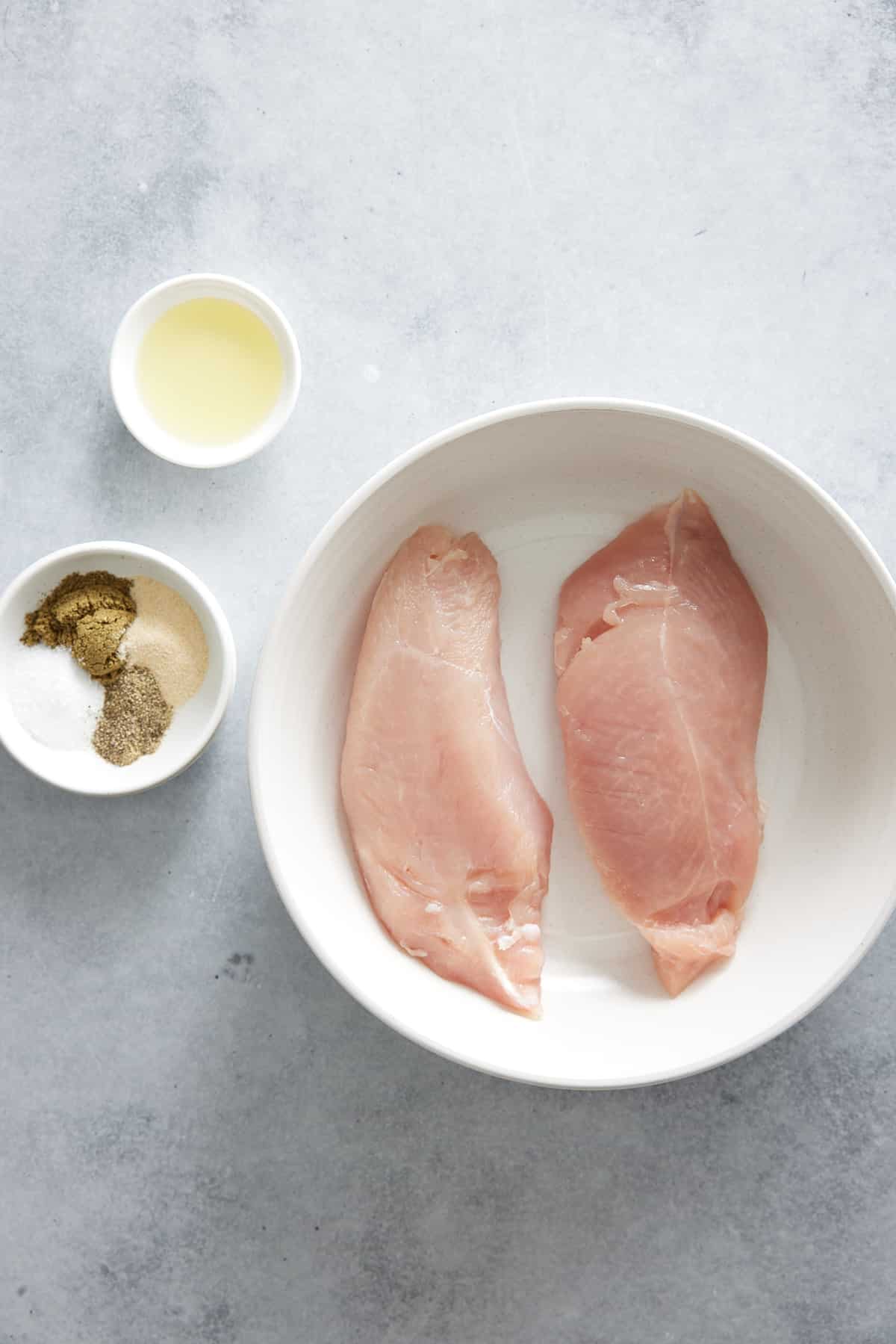 Air fryer turkey tenderloin ingredients set into individual white bowls