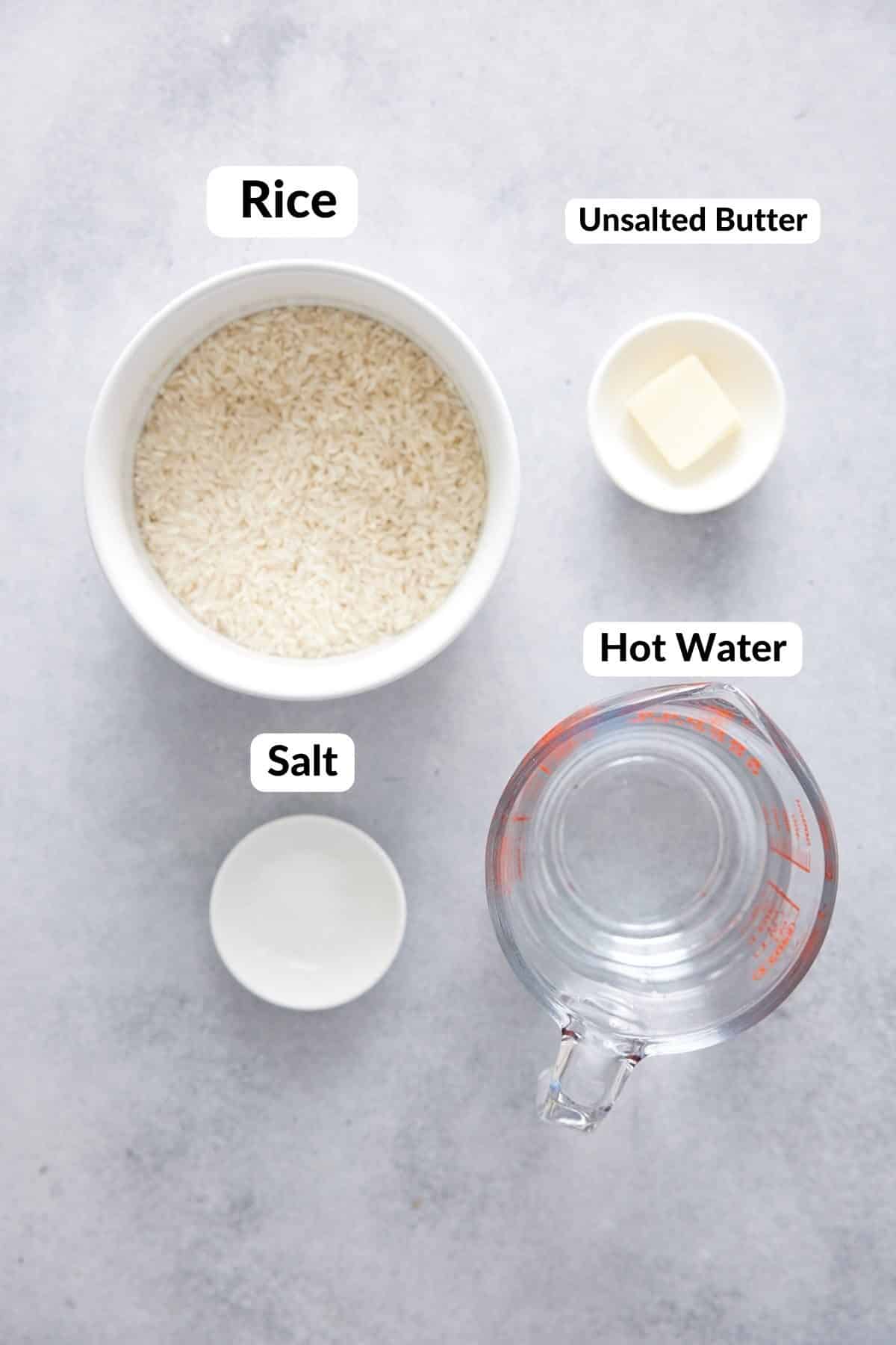 ingredients for oven baked rice with text naming the rice, hot water, butter, and salt