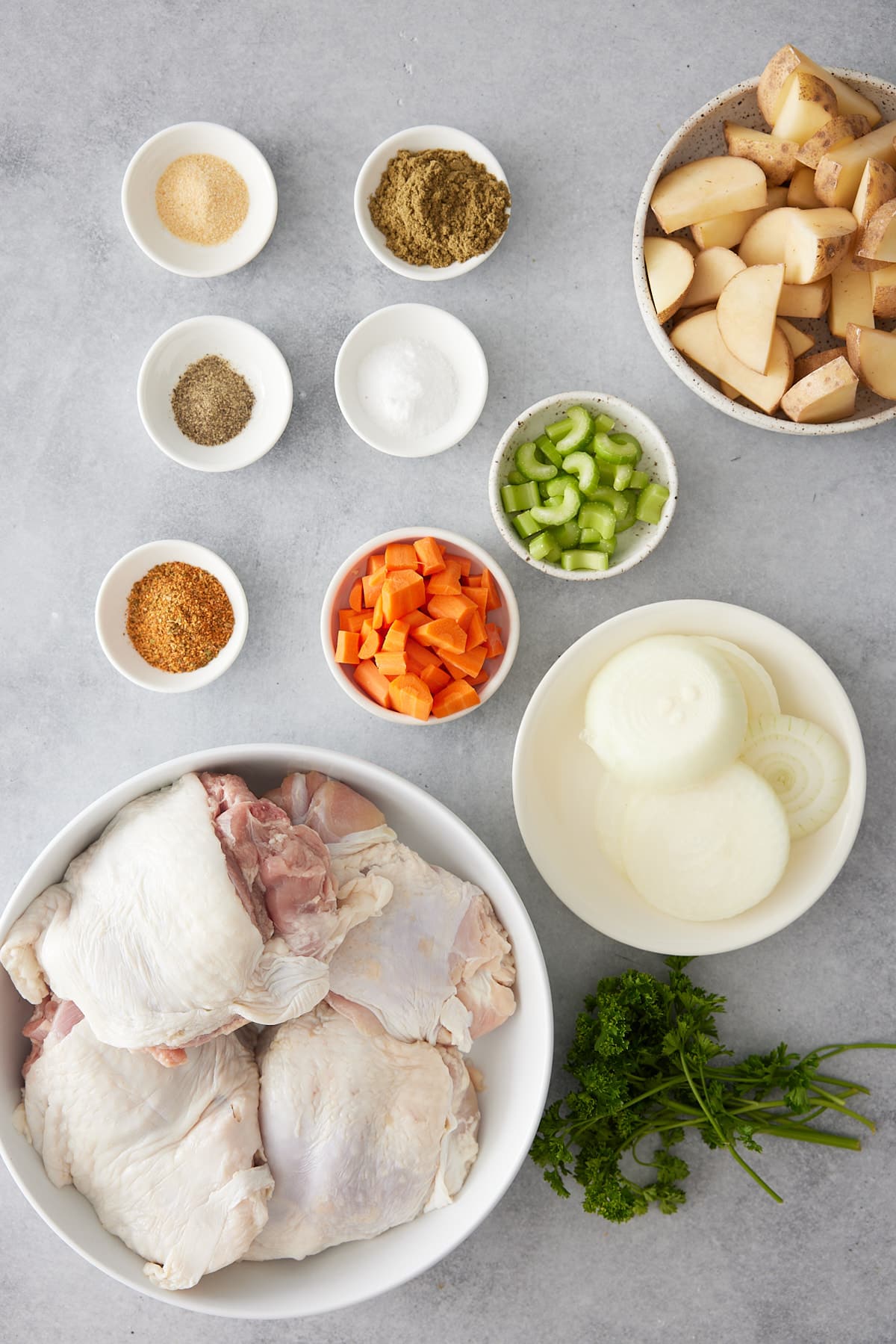 Oven baked turkey thighs recipe ingredients set into individual white bowls