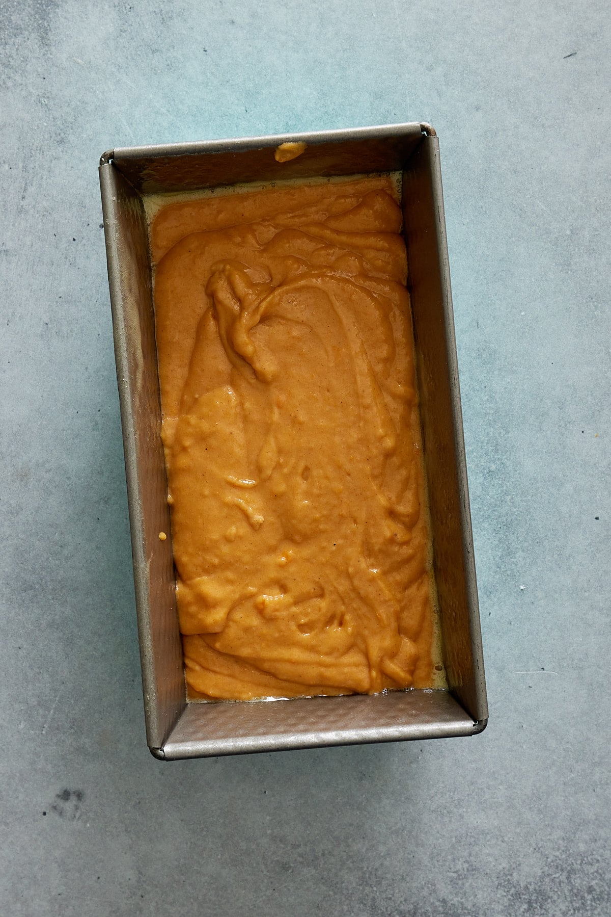 sweet potato bread mixture in a bread pan