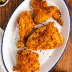 Air fryer fried chicken on a white platter
