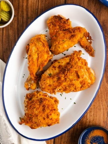 Air fryer fried chicken on a white platter