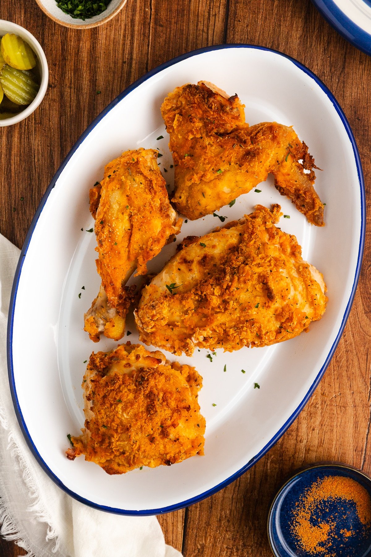 Air fryer fried chicken on a white platter