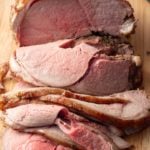 sliced leg of lamb on cutting board