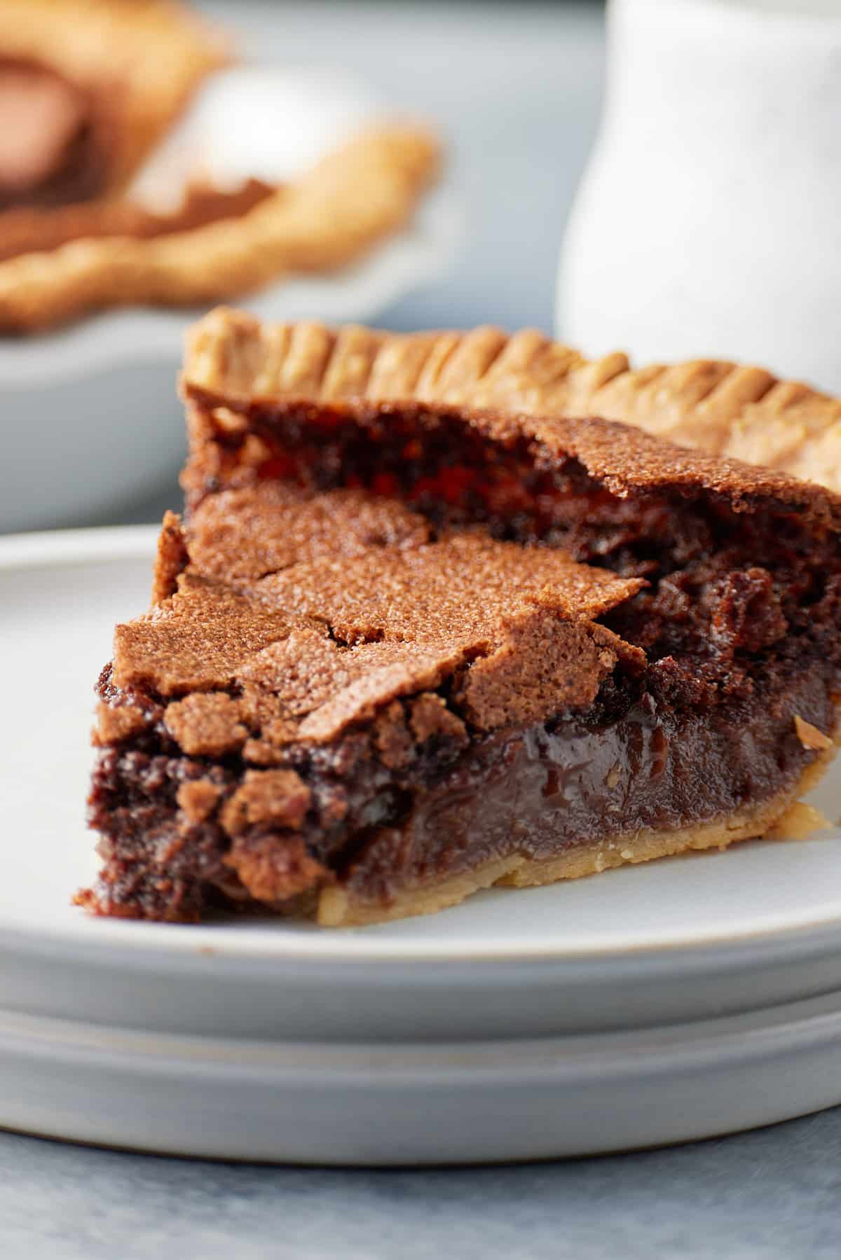 A slice of chocolate chess pie served on a plate