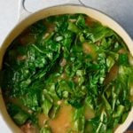 collard greens placed into the dutch oven