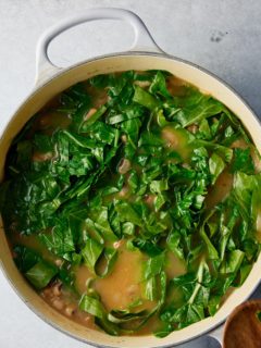 collard greens placed into the dutch oven