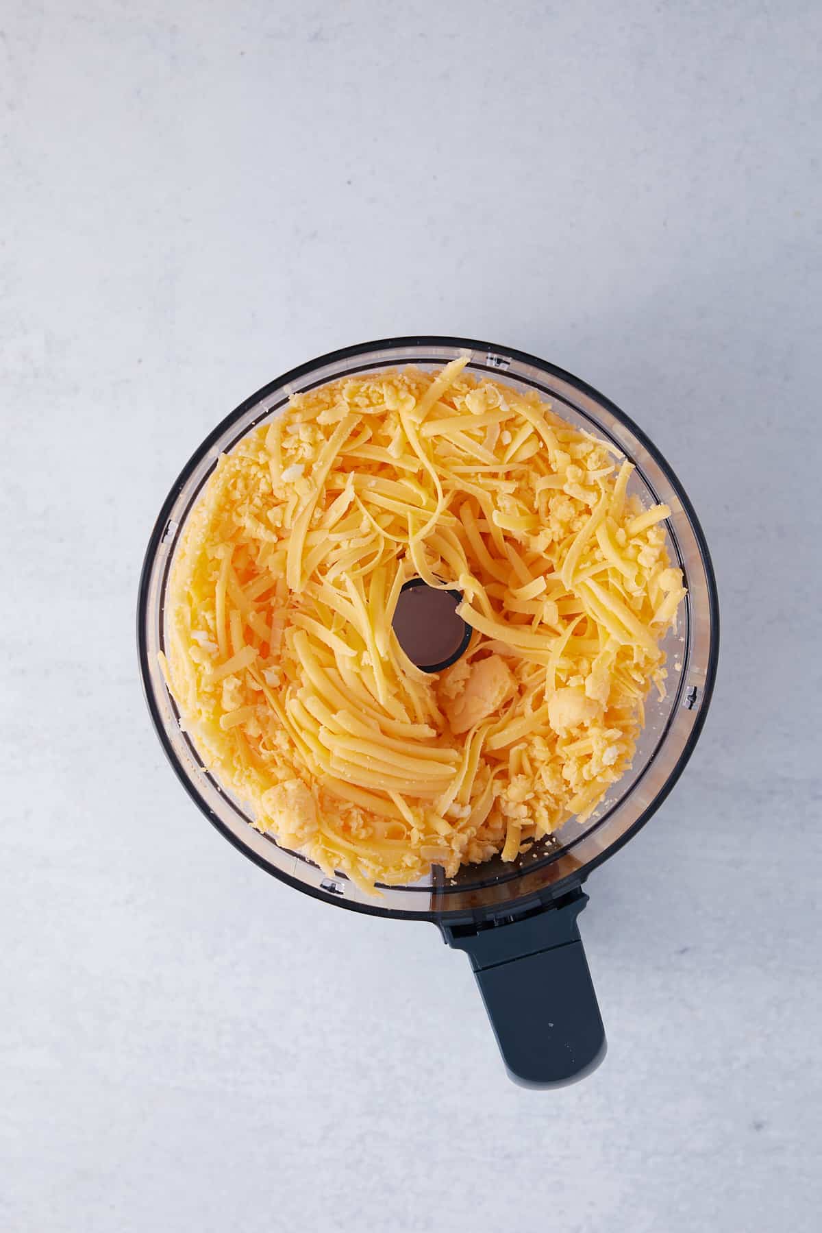 Shredded cheese in a food processor