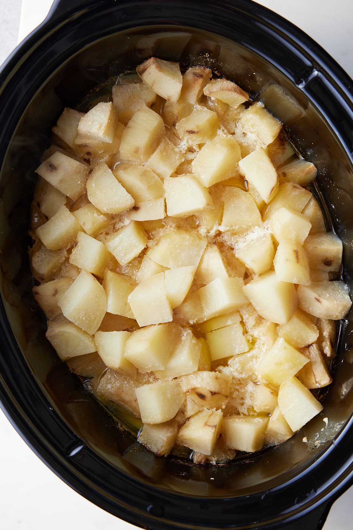 cubed potatoes in a slow cooker