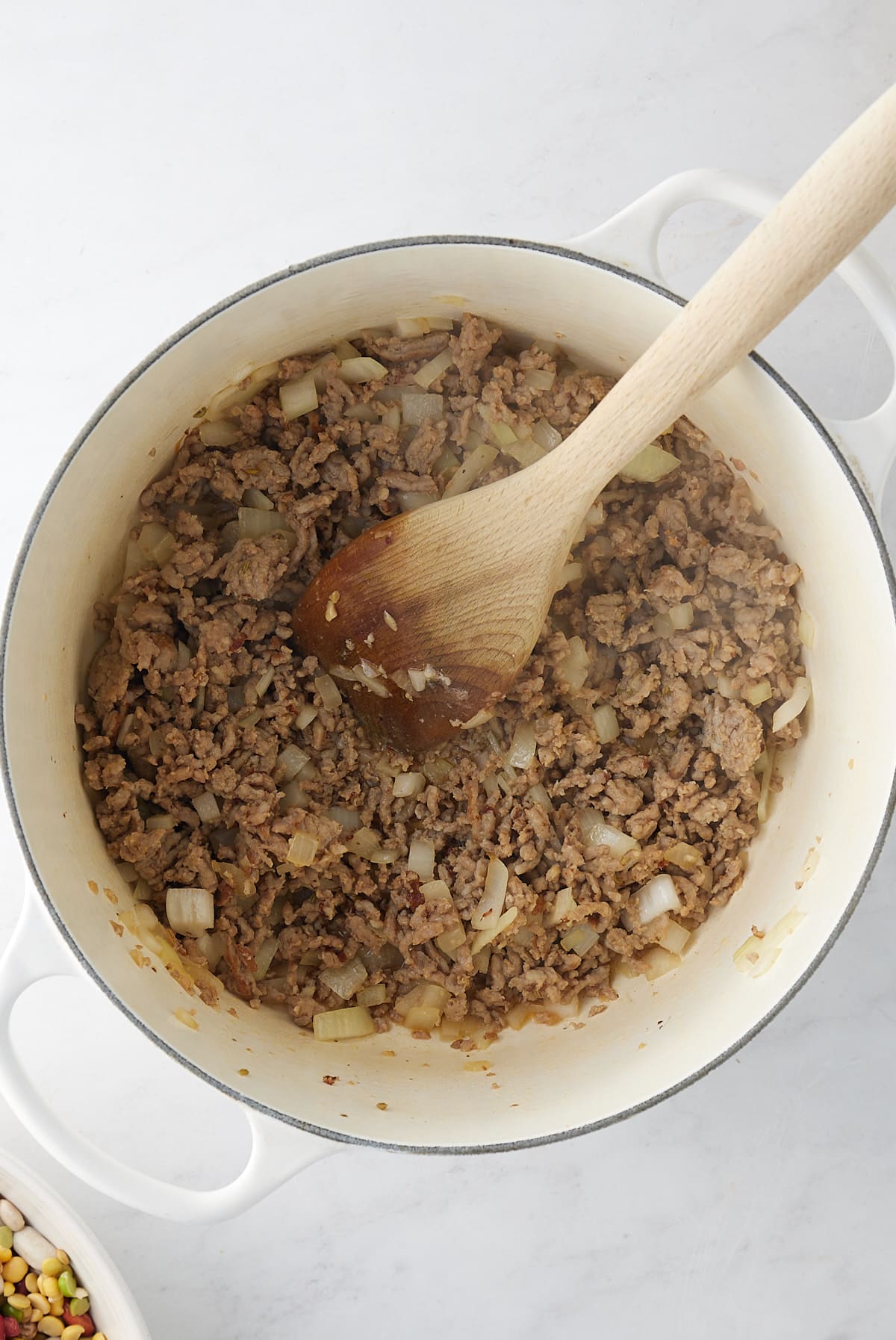 sausage and onion browning in a large pot