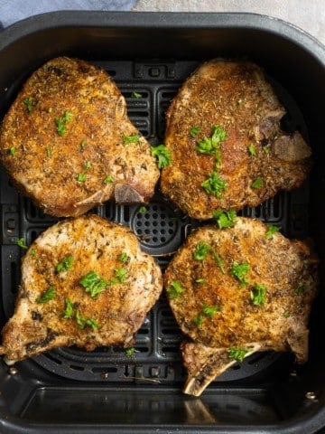 cooked pork chops in air fryer basket