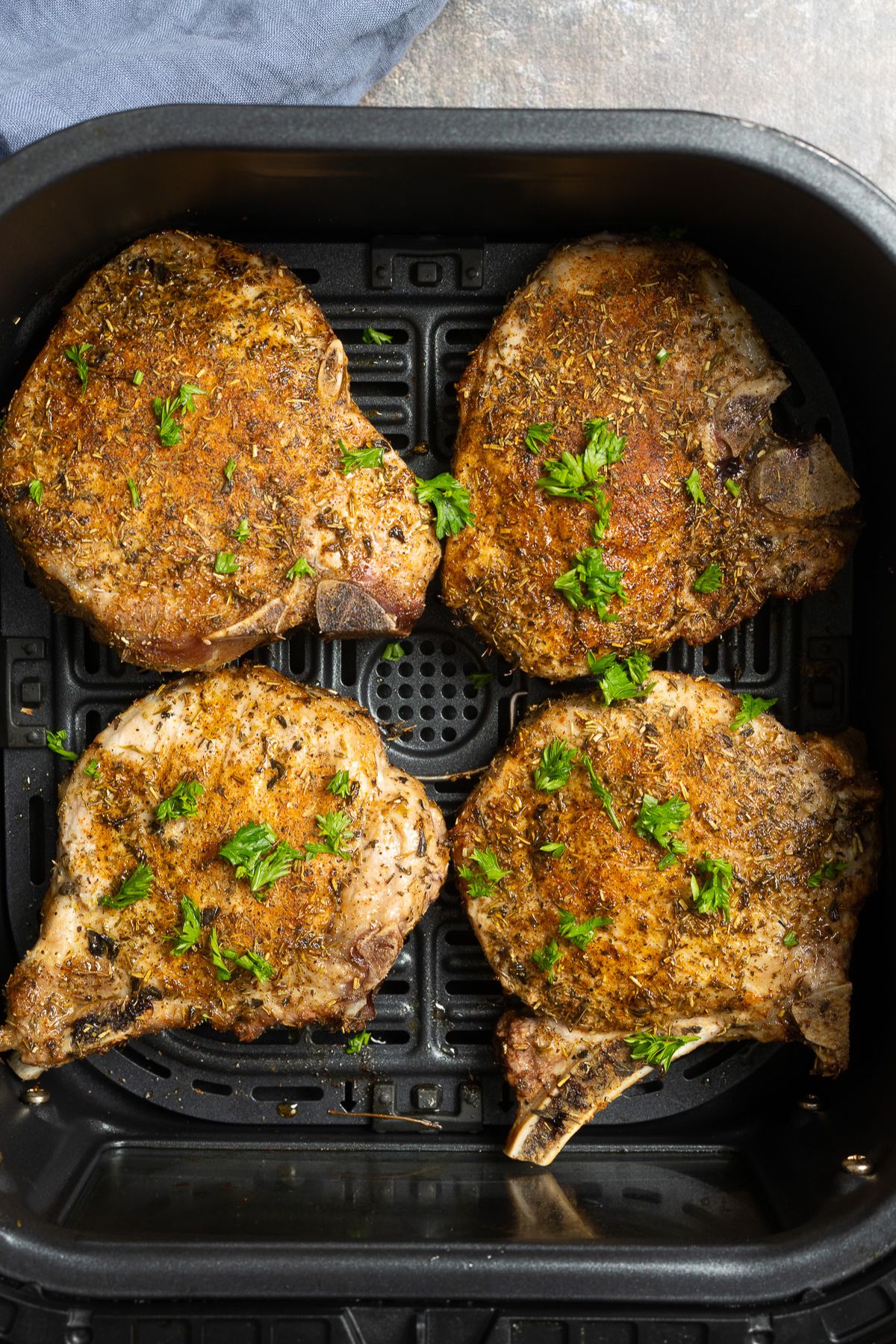 cooked pork chops in air fryer basket