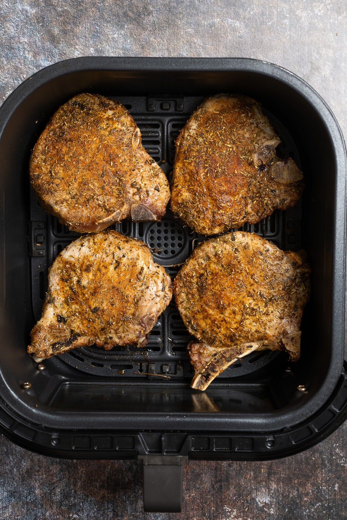 cooked pork chops in air fryer basket