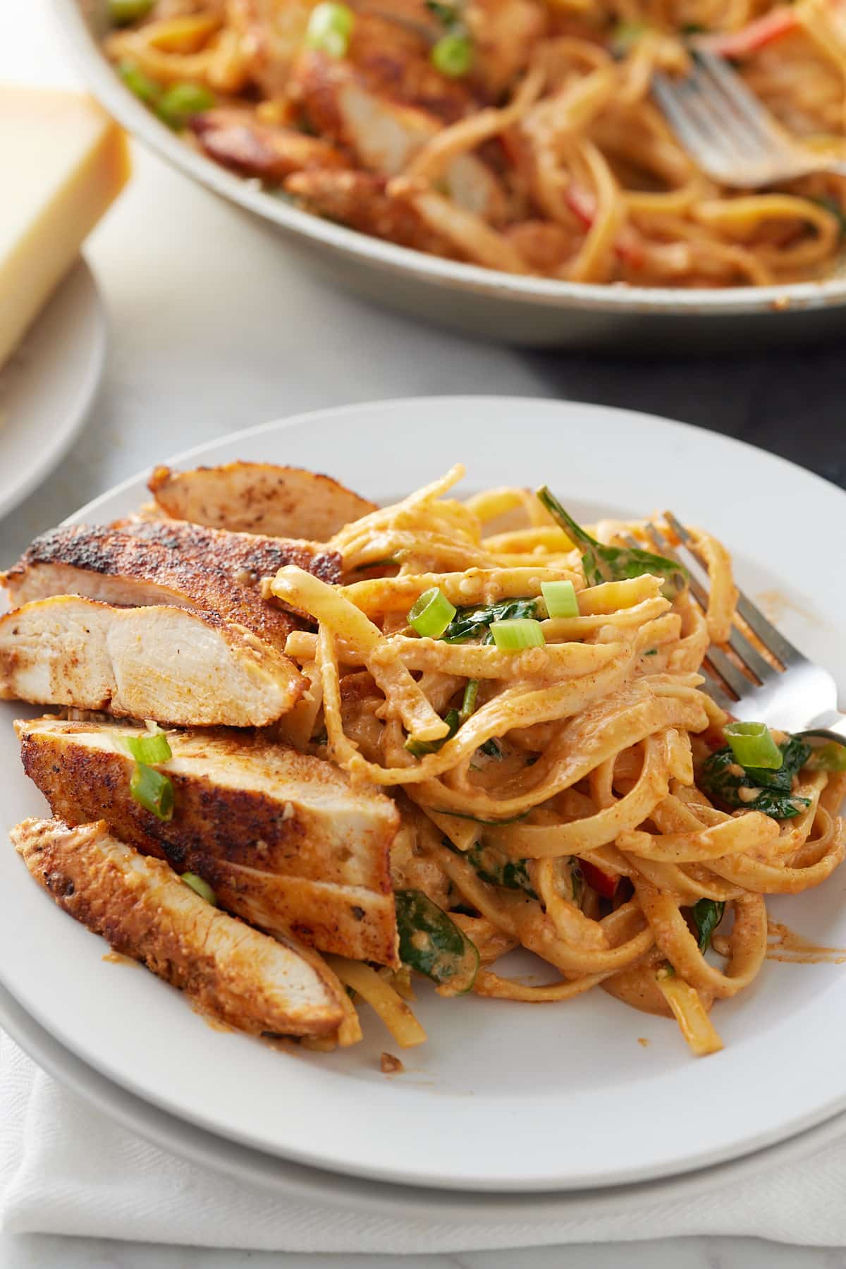 plated blackened chicken Alfredo on a plate