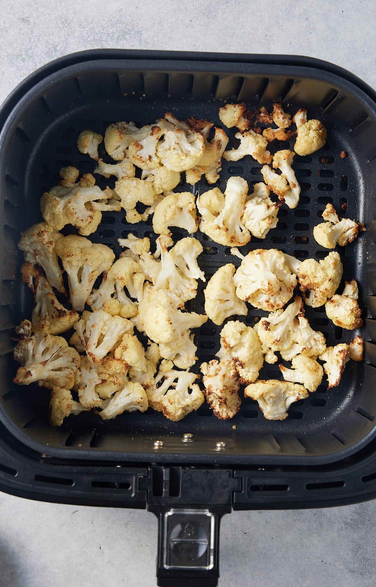 roasted cauliflower in air fryer basket