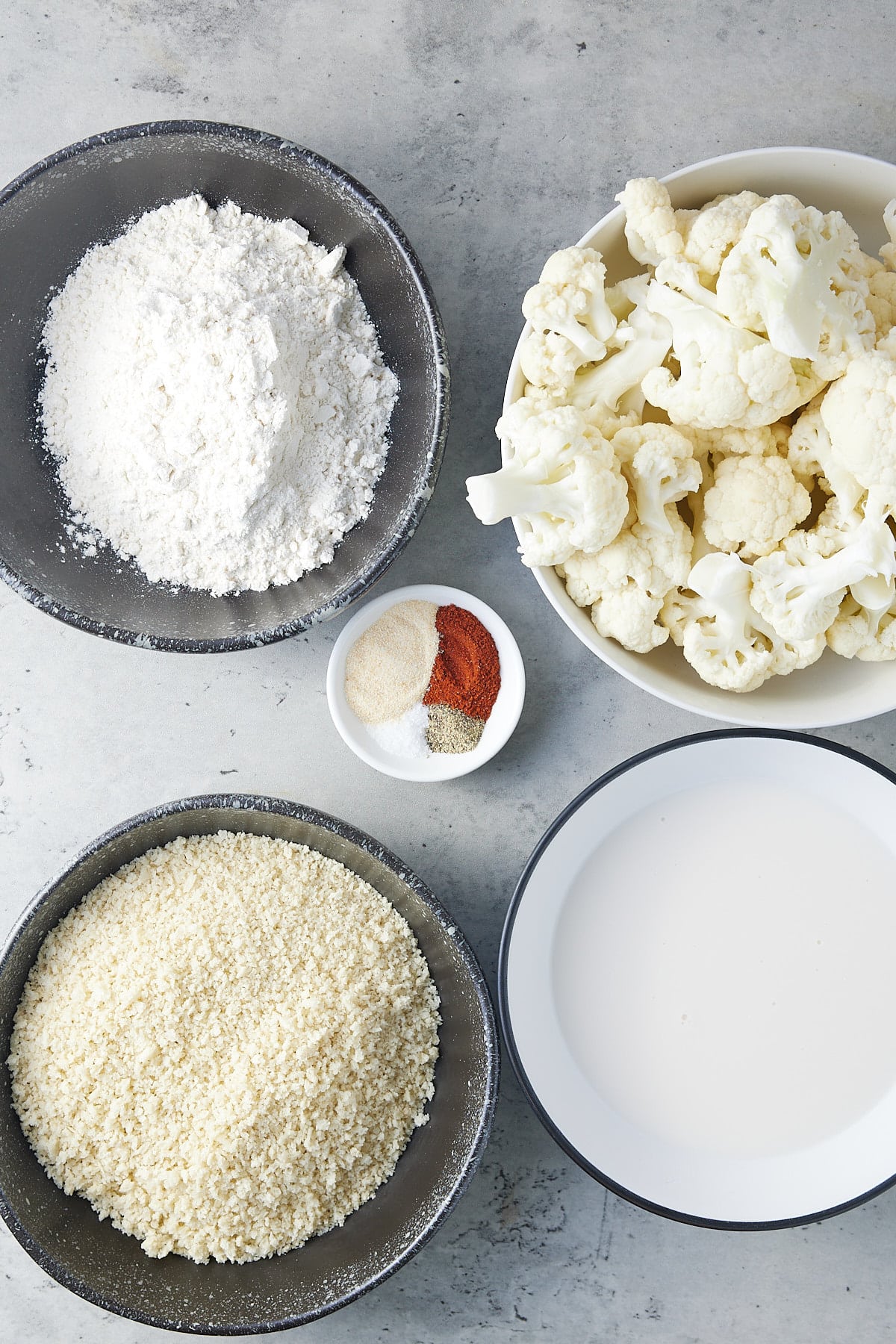 air fryer cauliflower wings ingredients set into individual bowls