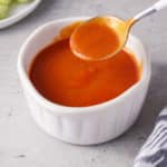 white bowl filled with buffalo sauce