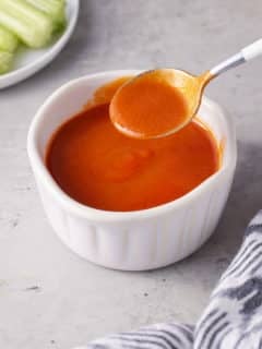 white bowl filled with buffalo sauce
