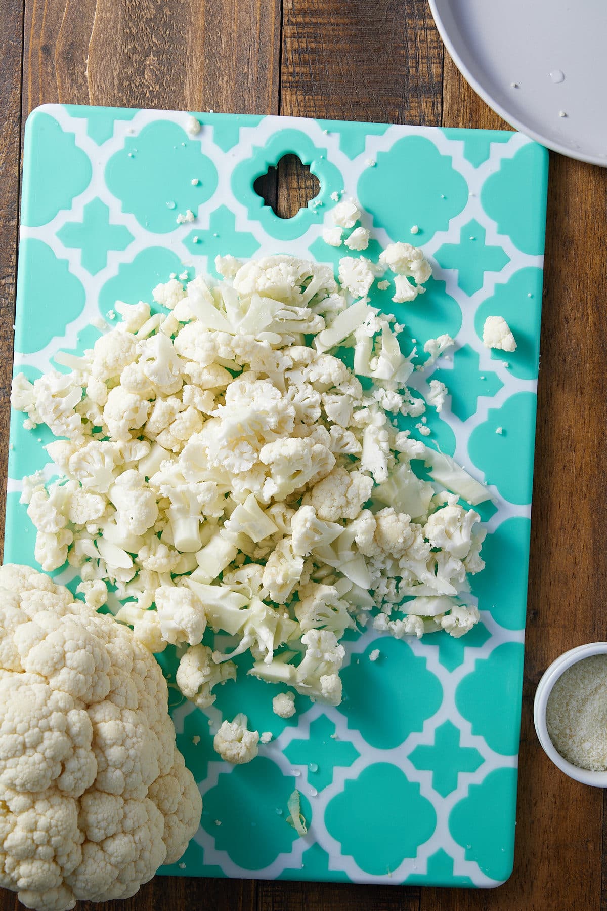 chopped cauliflower on a cutting board