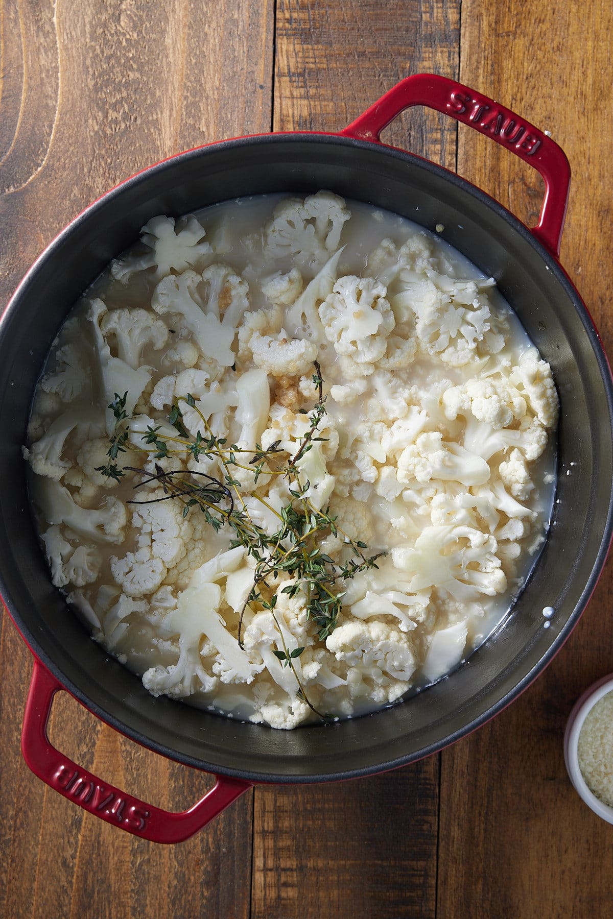 large pot full of cauliflower soup ingredients