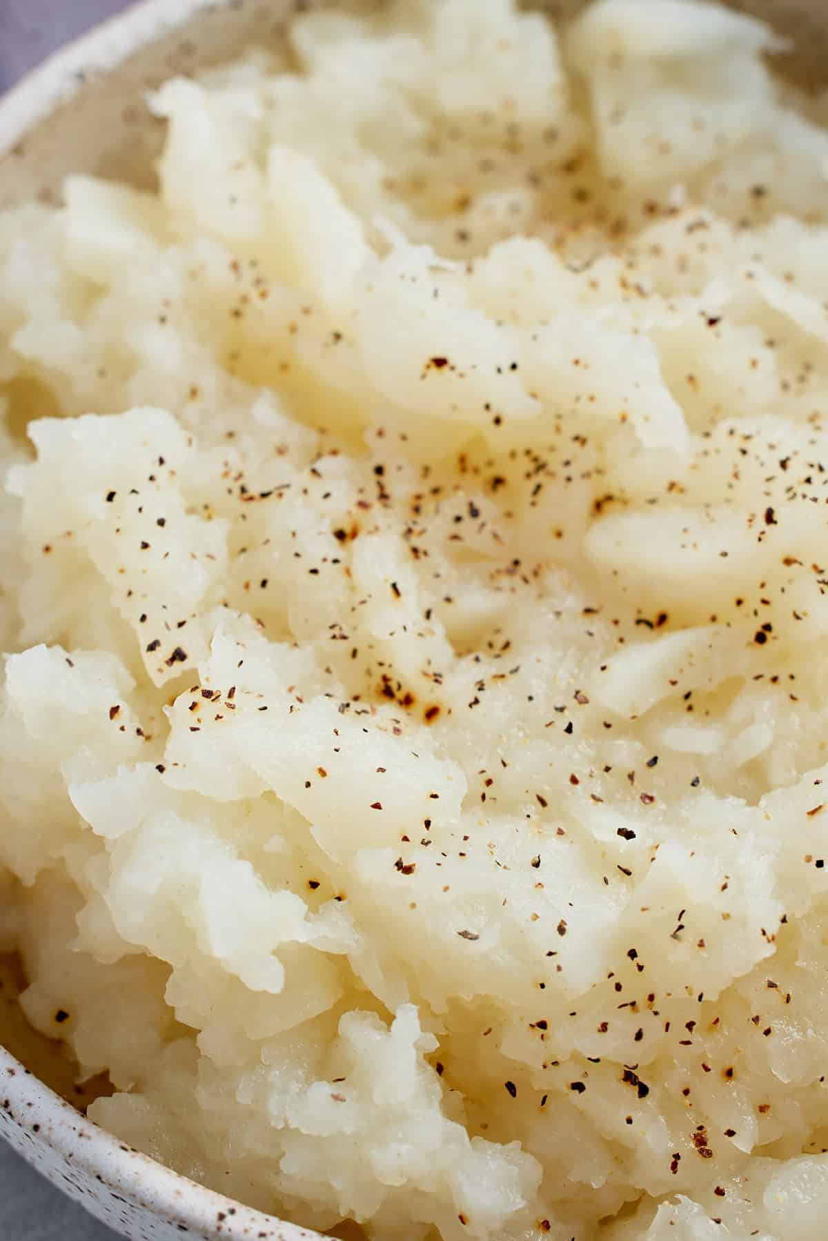 close up of a bowl of mashed turnips
