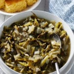 turnip greens in a bowl alongside corn bread