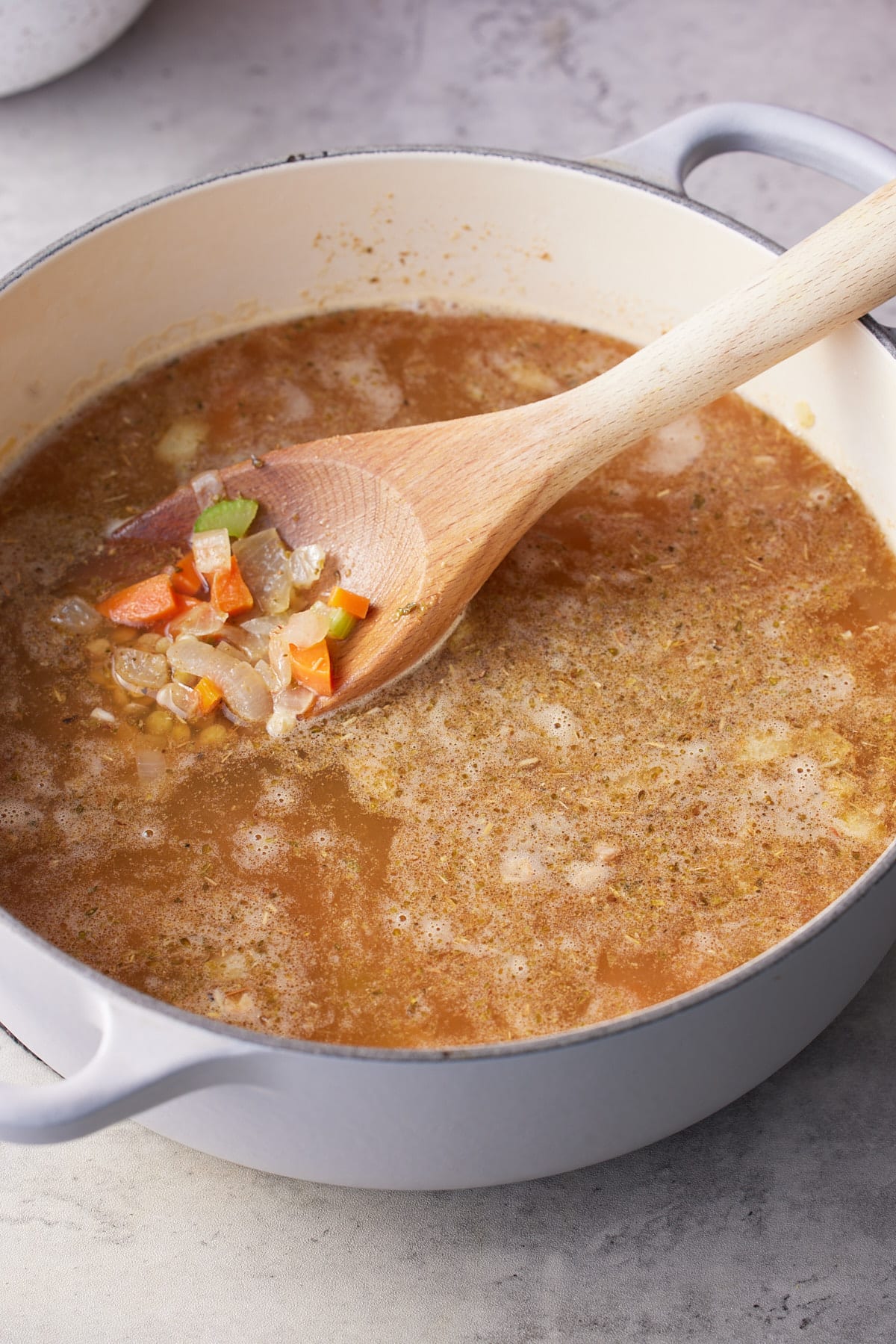 Broth added to the dutch oven.