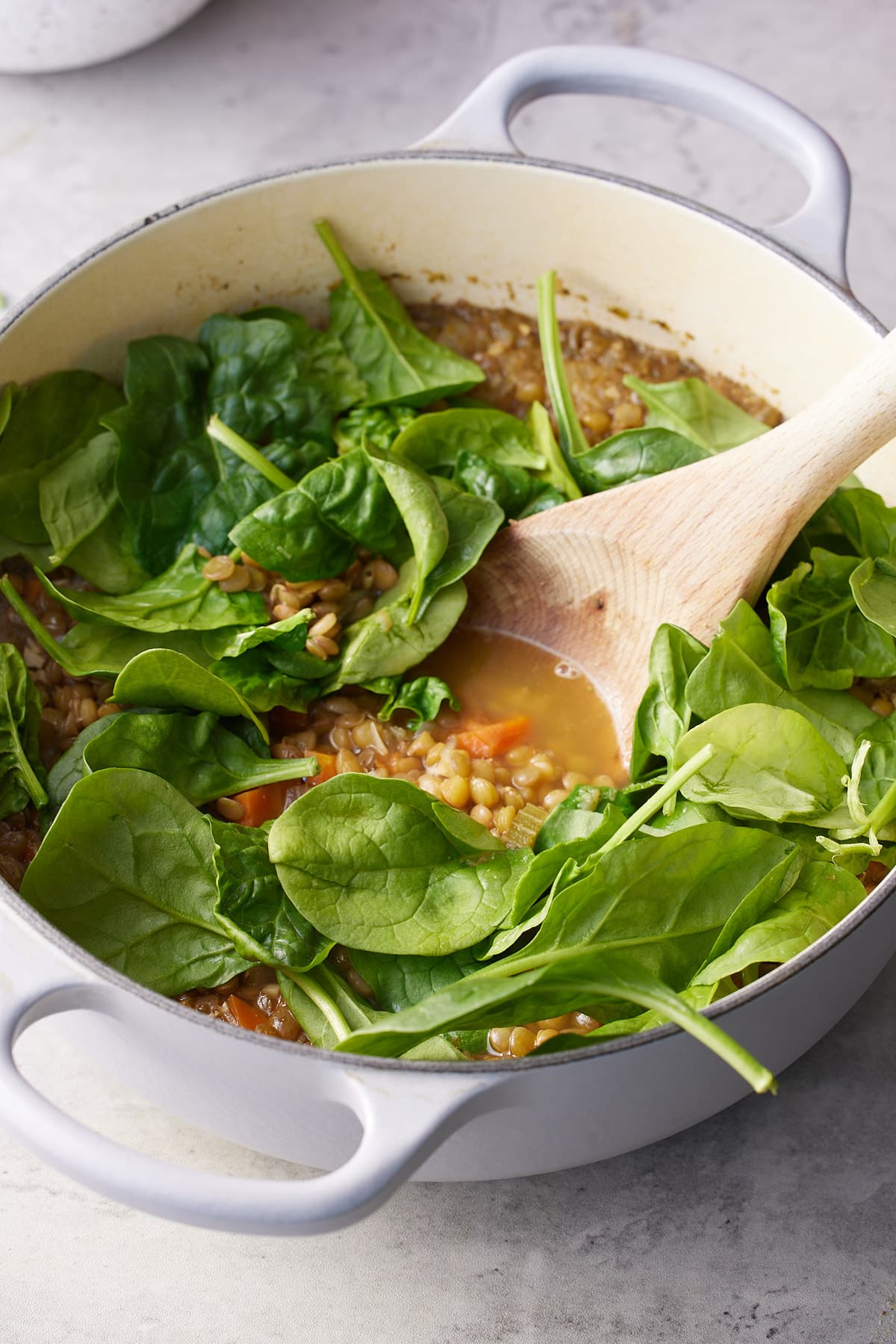 Spinach added to the dutch oven and allowed to wilt.