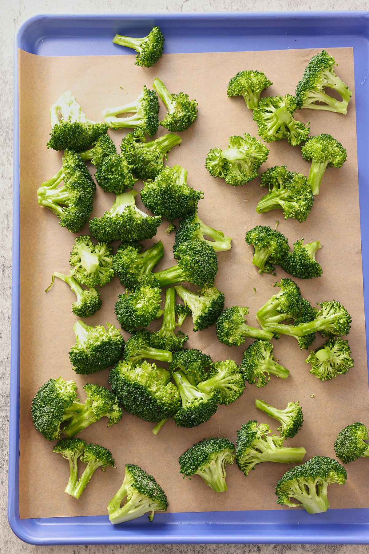 broccoli florets on a large baking sheet