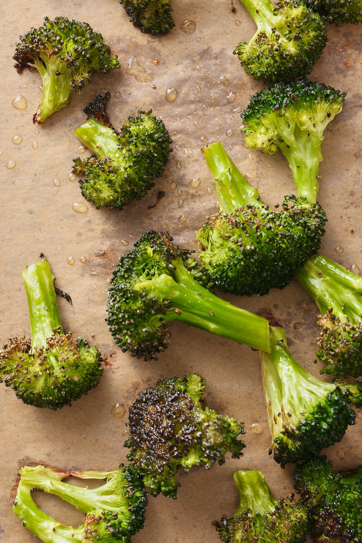 baked broccoli florets on a baking sheet 