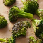 oven roasted broccoli on a baking sheet